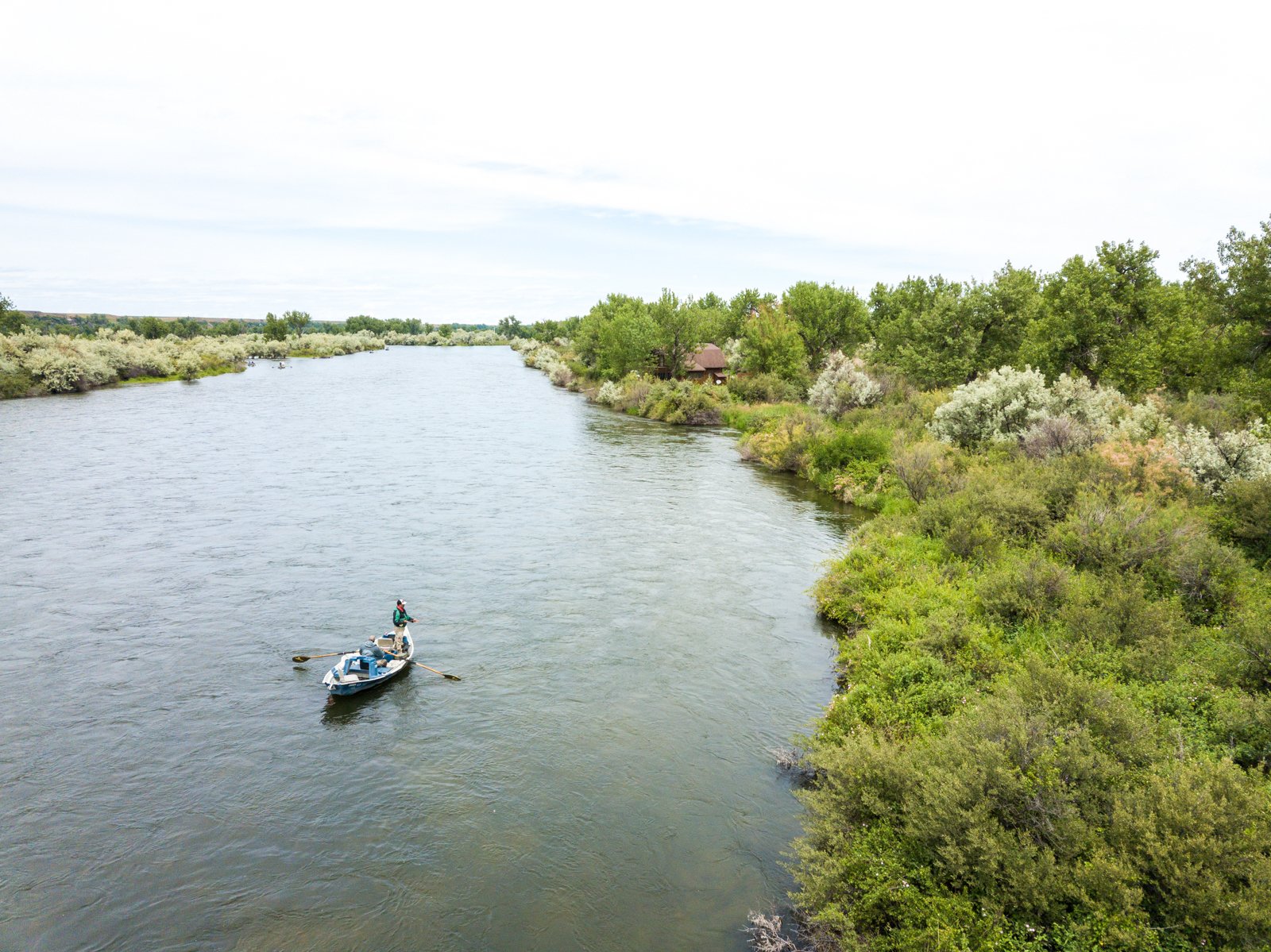 fly fisher in a boat