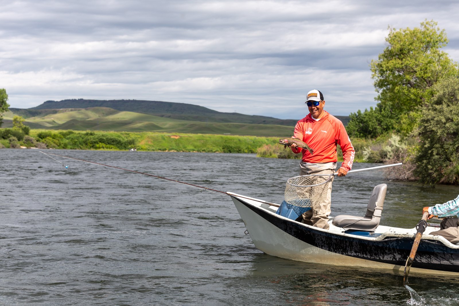 fly fisher in a boat