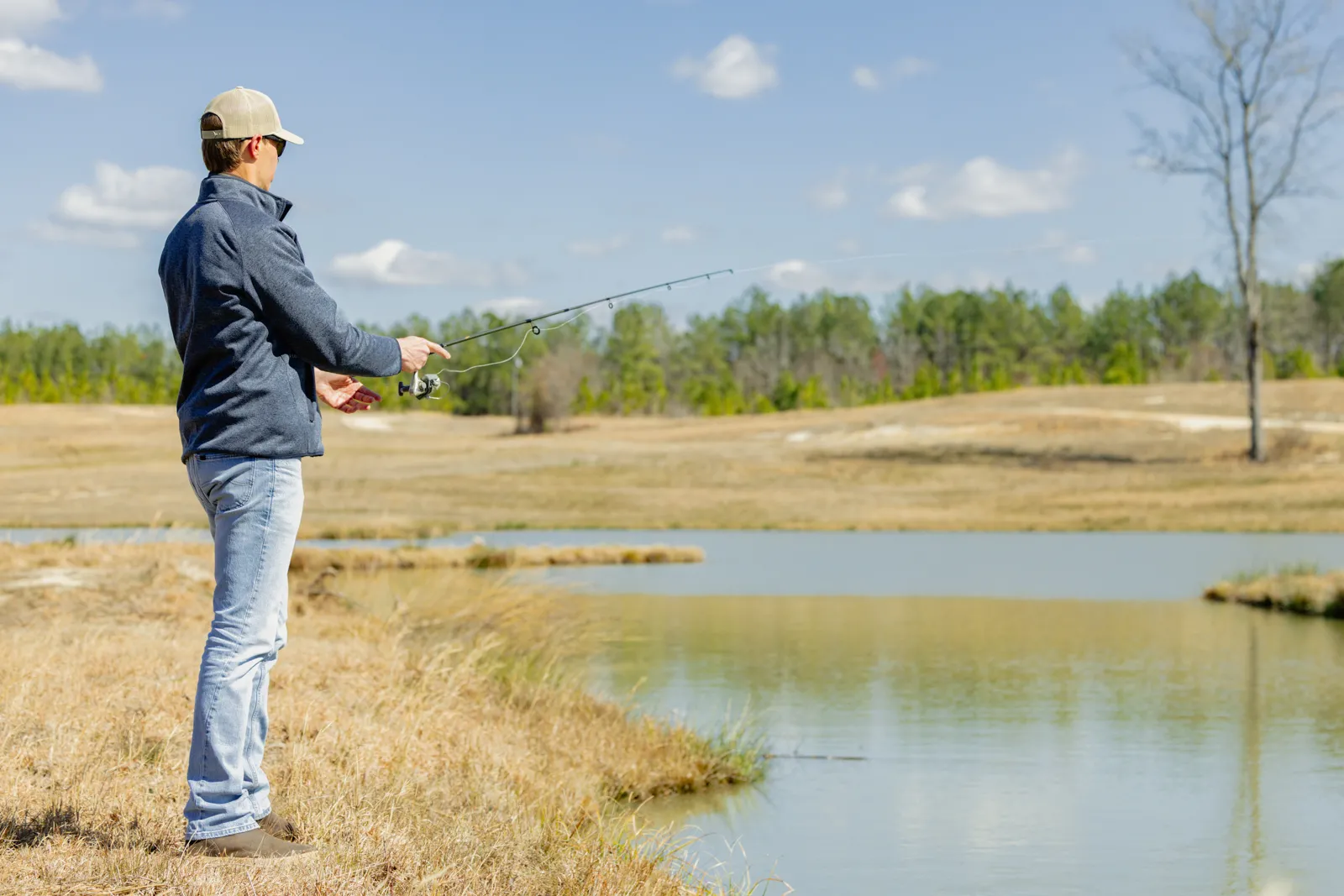 man fishing on farm in south carolina for sale